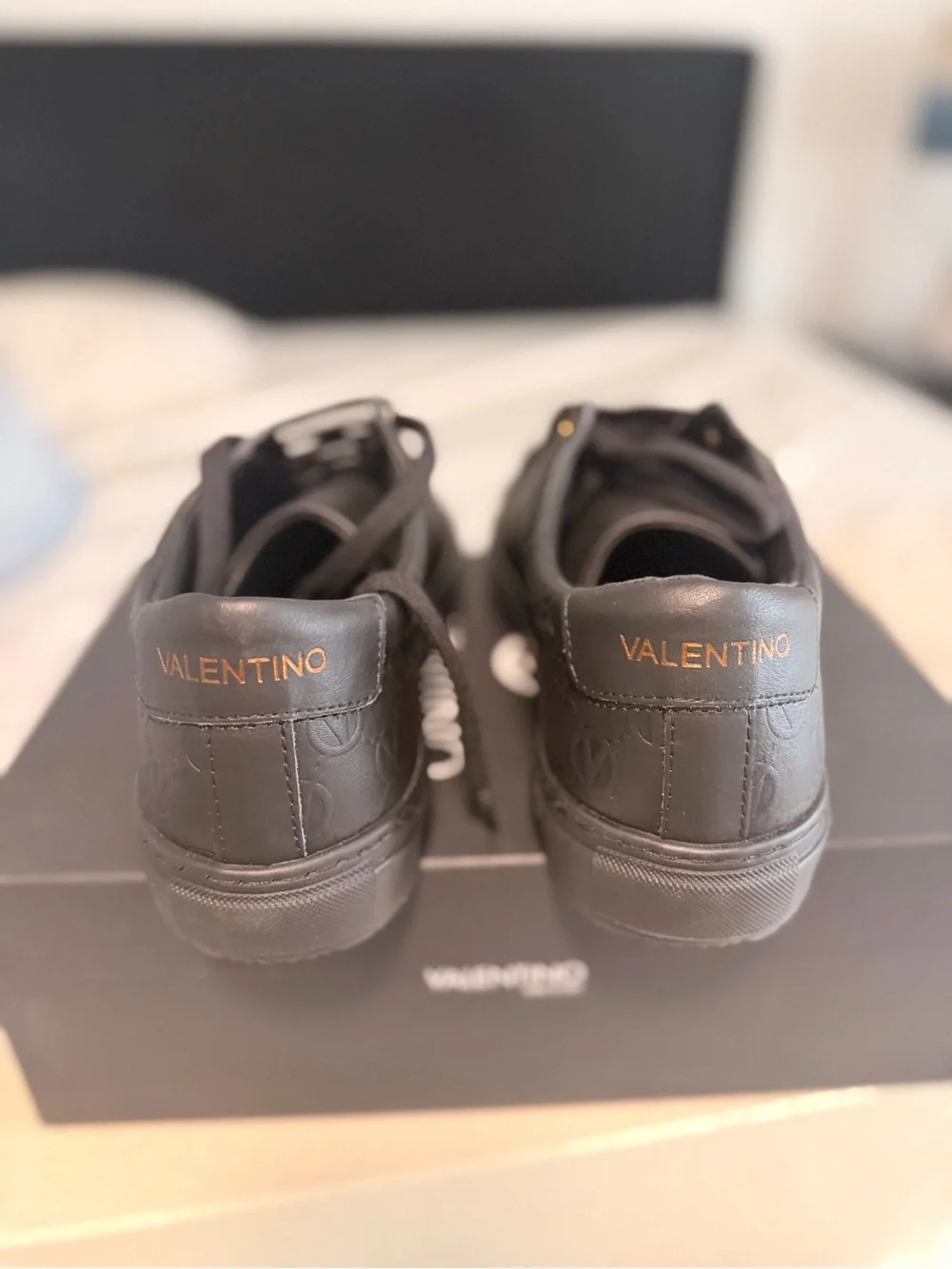 Valentino Men’s Black Leather Low-Top Sneakers with Gold Eyelets